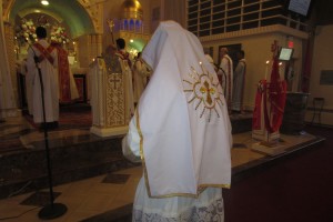 Father Anthony covered with veil during Chorbishop consecration. His Holiness celebrating Eucharist.