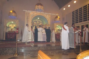 Book of Gospels placed on head of Chorbishop Anthony and His Holiness ordaining.